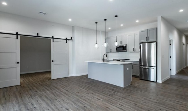 a kitchen with white cabinets