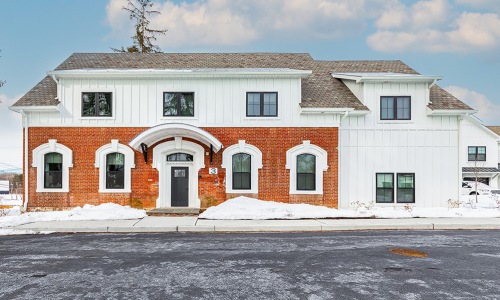 a brick building with a street in front